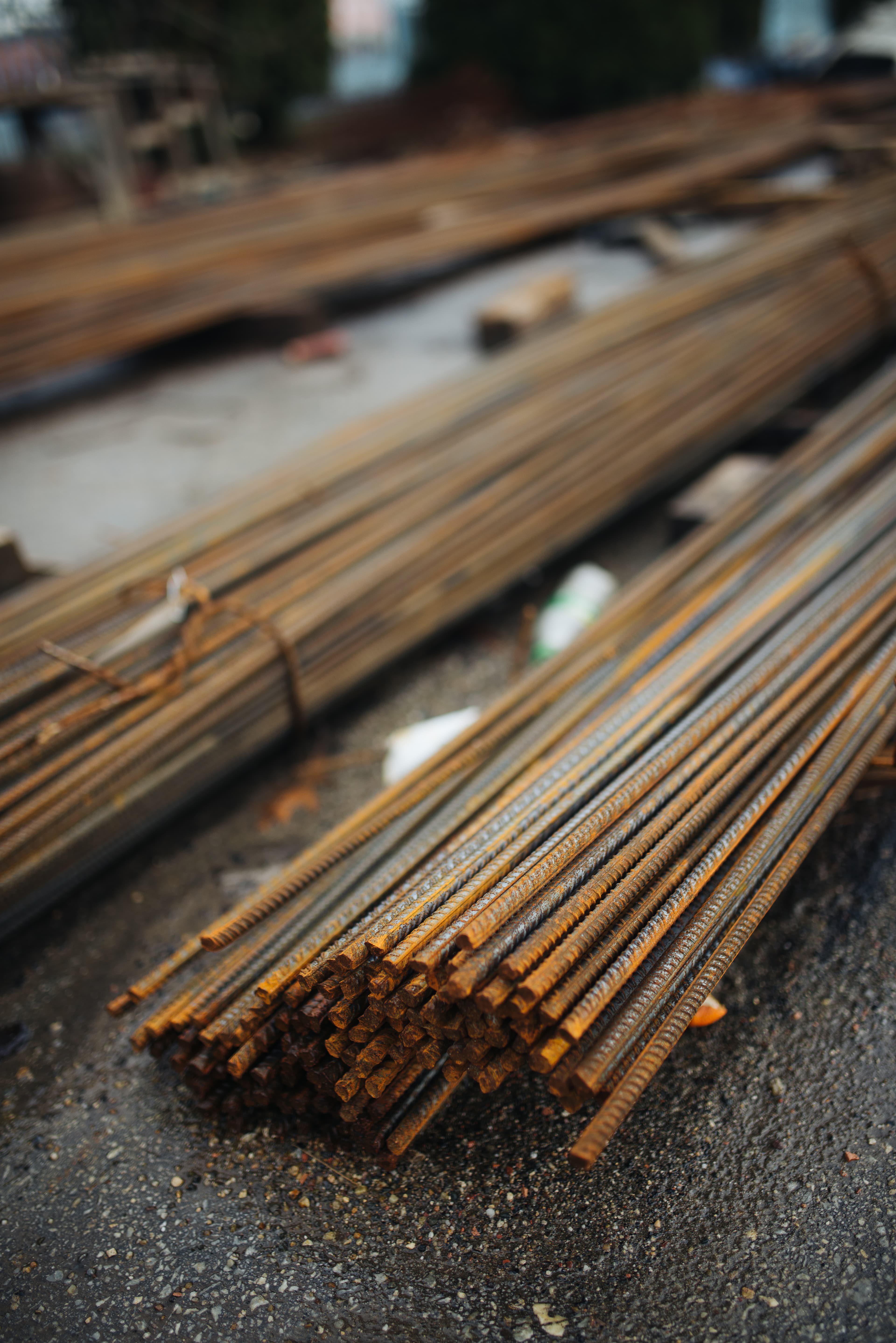 Bundles of straight ribbed reinforcing bars with visible cut ends and surface texture — reference photo, not the exact supplied product